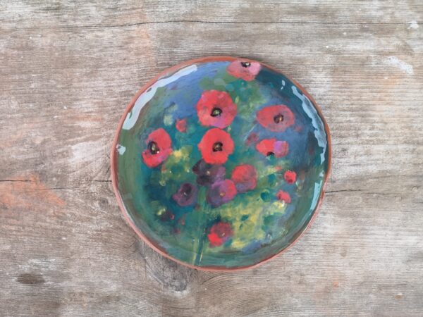 Hand painted ceramic decorative plate with flowers motive