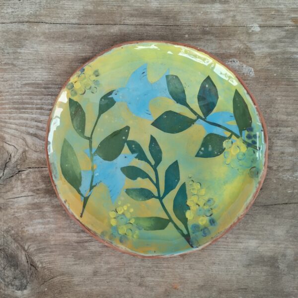 Hand painted ceramic decorative plate with birds motive