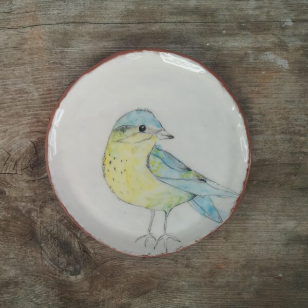 Hand painted ceramic decorative plate with bird motive