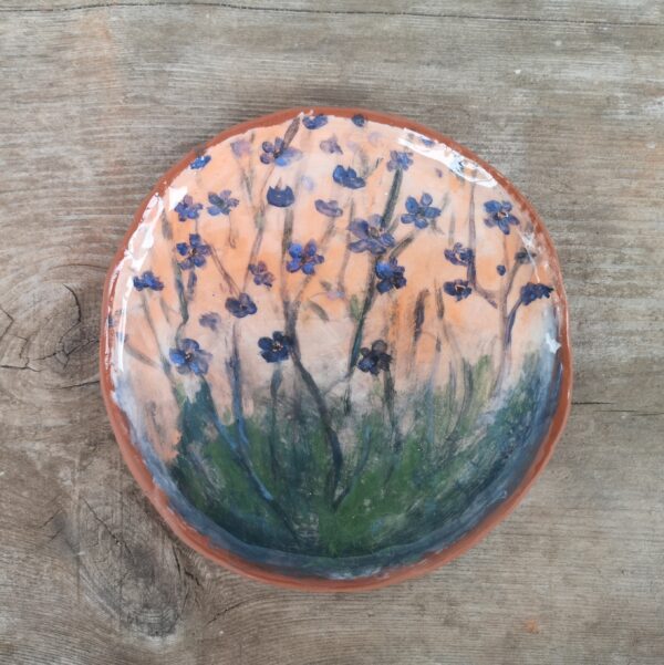 Hand painted ceramic decorative plate with flowers motive